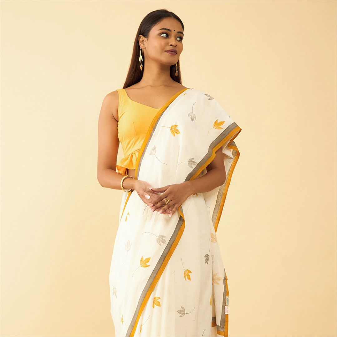 This Khadi saree showcases a stunning blend of nature's artistry and contemporary design, featuring impression prints cr...